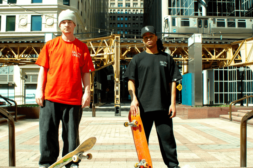 Two skateboarders wearing mental health hoodies and t-shirts, promoting positive mental health through active urban lifestyle.