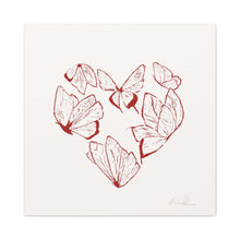 Heart-shaped butterfly artwork on white canvas, "First Site" print, showcasing love and creativity in red detailed art