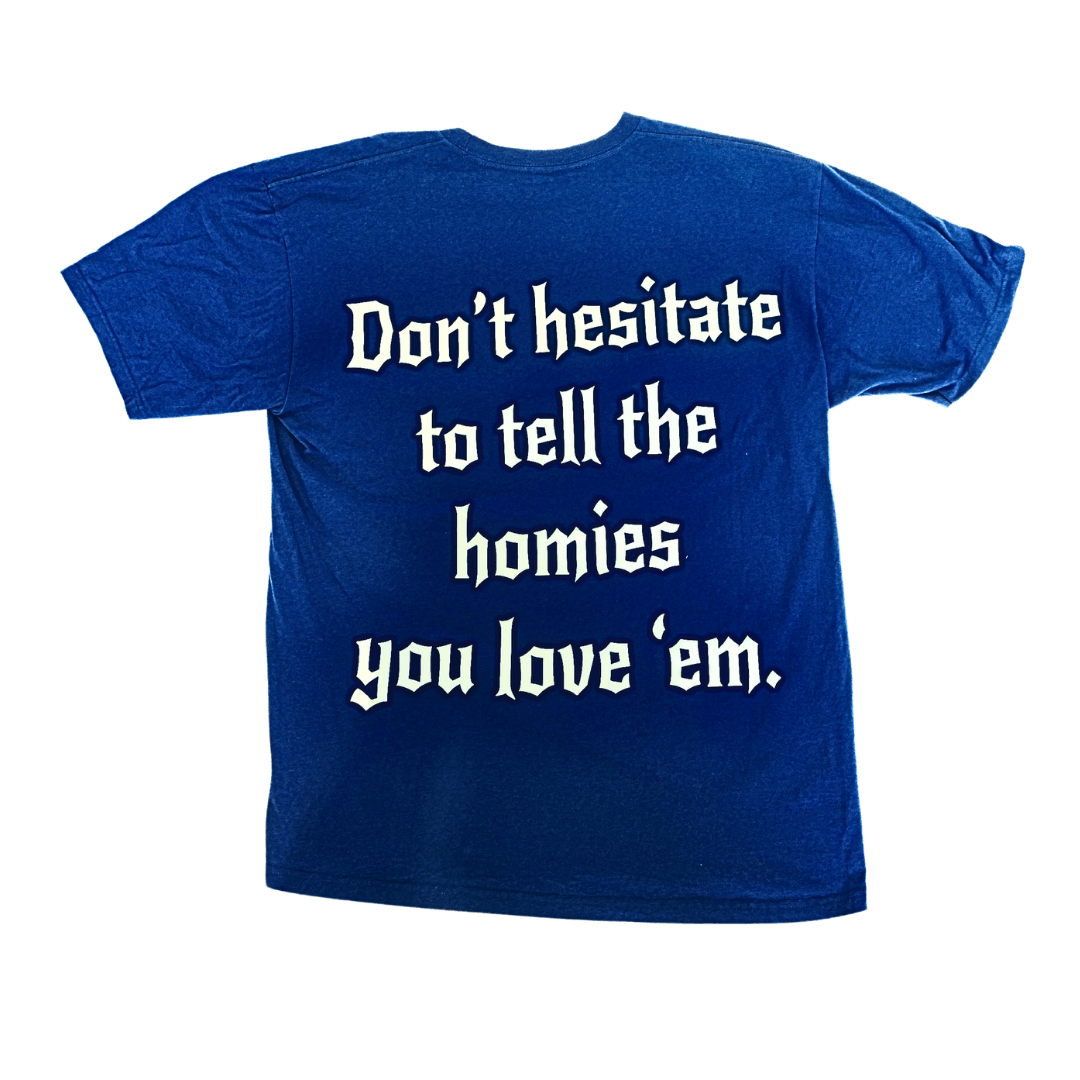 Blue tee with "Don't hesitate to tell the homies you love 'em" message, made from 100% organic cotton, sustainable and comfortable