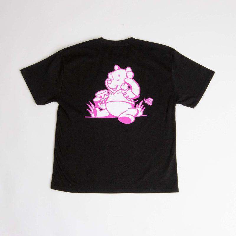Black organic cotton Winnie Tee by callyourfriends, featuring a pink Winnie the Pooh bear graphic on the back, soft and sustainable t-shirt.